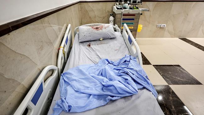 A bullet hole on a pillow covered in blood on a hospital bed at the Ibn Sina hospital in Jenin in the West Bank.