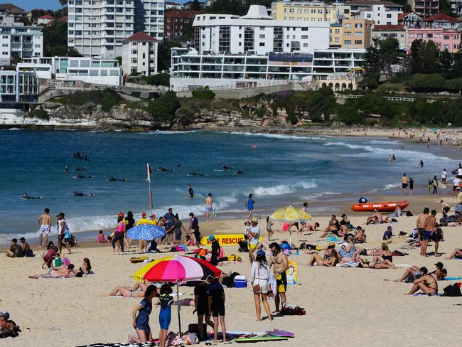 People enjoy the warm weather at Bondi Beach in Sydney. Picture: NCA Newswire/ Gaye Gerard