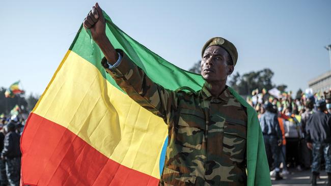 A man holds an Ethiopian flag during a rally in Addis Ababa in support of the national defence forces and vows to defend the capital. Picture: Eduardo Soteras