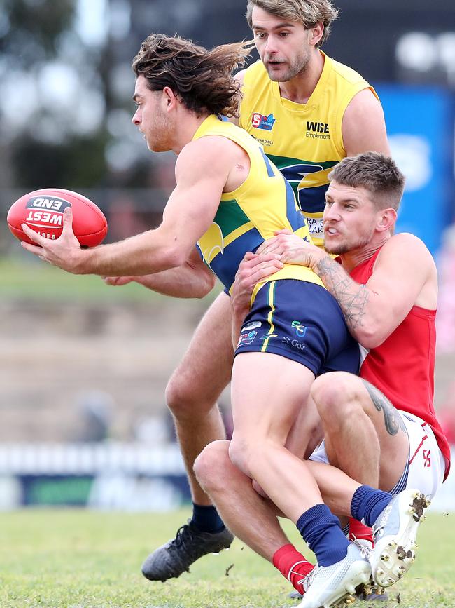 Jordan Foote is tackled by Rooster Elliot Chalmers. Picture: Sarah Reed