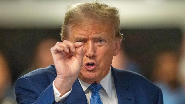 ’Will I disrupt Australian business? Well, maybe this much,’ Donald Trump seems to be (but isn’t) saying. Picture: Steven Hirsch AFP