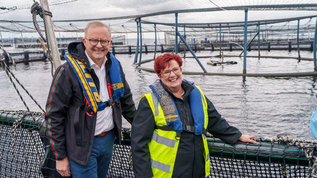 Prime Minister Anthony Albanese and Tasmanian Senator Anne Urquhart during a visit to the Tassal salmon pens in Strahan, in December last year, which pre-empted his promise to enact legislation that would “ensure appropriate environmental laws are in place to continue sustainable salmon farming in Macquarie Harbour”. Picture: POOL/NewsWire