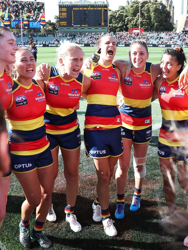 Crows players celebrate their 18-point preliminary final win over Melbourne, which booked the team their third grand final appearance in five years. Picture: Sarah Reed/AFL Photos via Getty Images