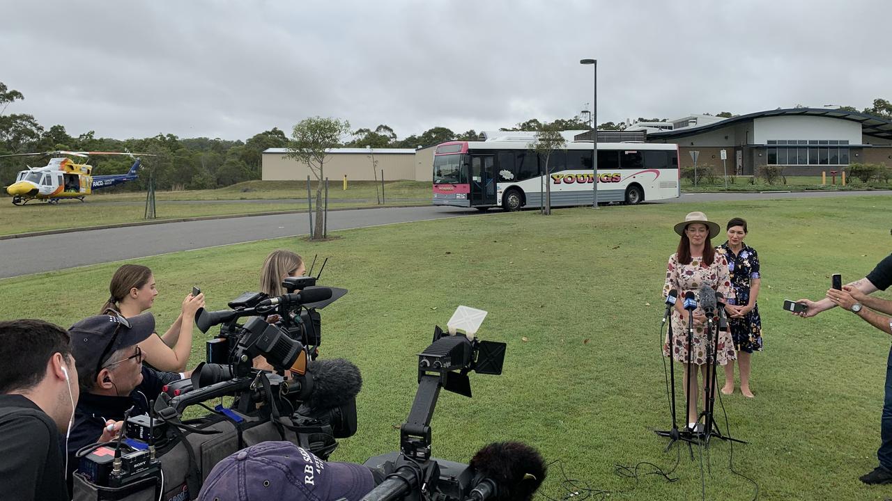 Labor's incumbent candidate for Keppel Brittany Lauga and Minister for Science Leeanne Enoch with the RACQ Rescue Helicopter and Capricorn Coast Hospital in the background.