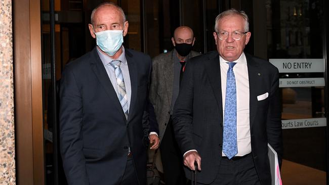 Chris Dawson, left, leaves the Supreme Court of NSW in Sydney on Wednesday. Picture: AAP