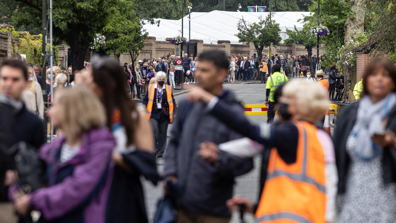 Tennis fans queue to enter the Wimbledon All England Tennis Club ahead of day one of the Wimbledon tennis championships. Picture: Getty