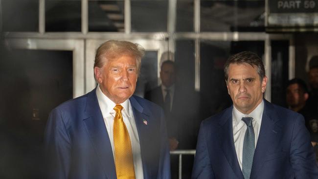 Lawyer Todd Blanche with Donald Trump at the end of the day of his criminal trial at the New York State Supreme Court on Thursday. Picture: Pool/AFP