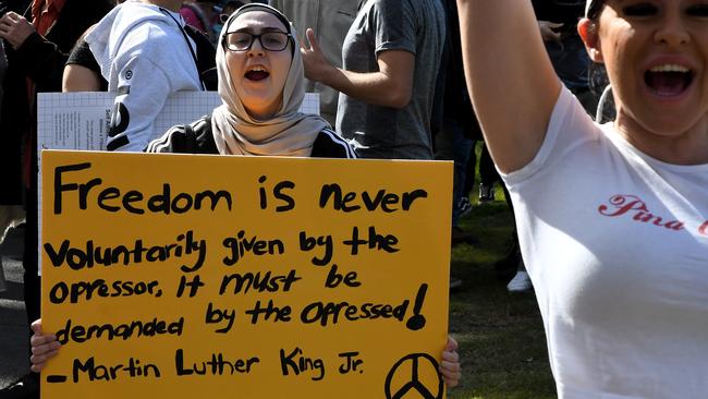 A demonstrator holds a placard during the Sydney protest.