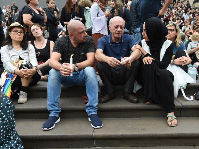 Saeed Maasarwe is comforted at a vigil to honour his daughter Aiia. Picture: Tony Gough