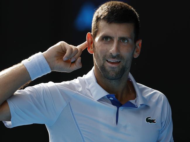 MELBOURNE , AUSTRALIA. January 23 , 2024. Australian Open Tennis. Day 9.  Novak Djokovic vs Taylor Fritz  on Rod Laver Arena.   CanÃt hear you. Novak Djokovic gestures to the crowd after winning a point late in the 1st set tiebreak  . Pic: Michael Klein