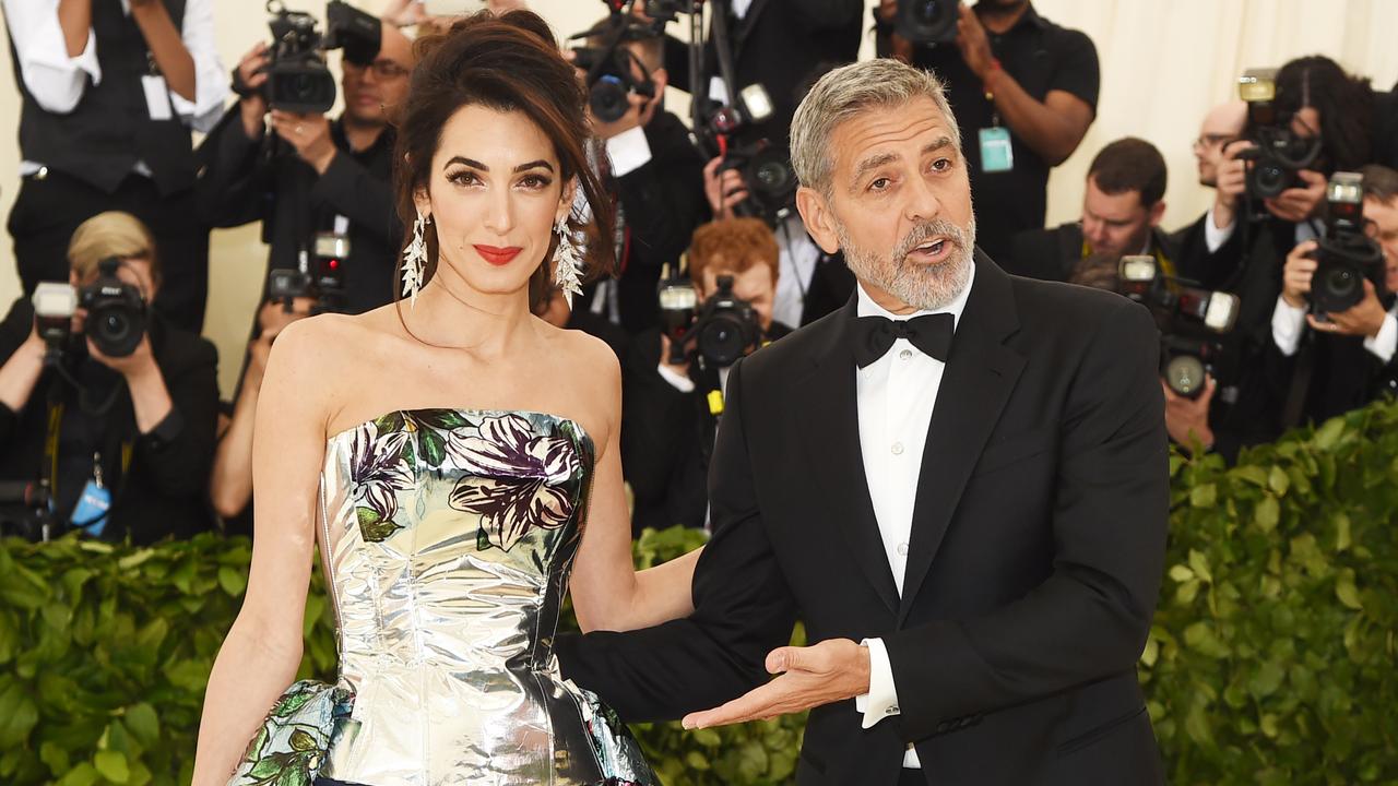 NEW YORK, NY - MAY 07:  Amal Clooney and George Clooney attend the Heavenly Bodies: Fashion & The Catholic Imagination Costume Institute Gala at The Metropolitan Museum of Art on May 7, 2018 in New York City.  (Photo by Jamie McCarthy/Getty Images)