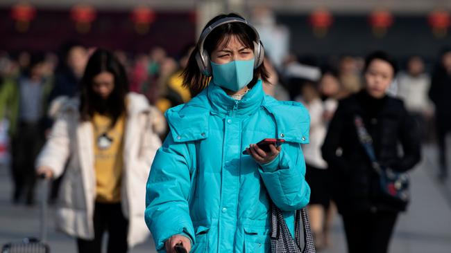 Passengers arrive at the train station in Hanzhong ahead of the Lunar New Year. Picture: AFP.