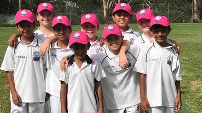Rouse Hill Rams Cricket Club's junior modified white side with their pink caps in support of the McGrath Foundation. Source: Facebook
