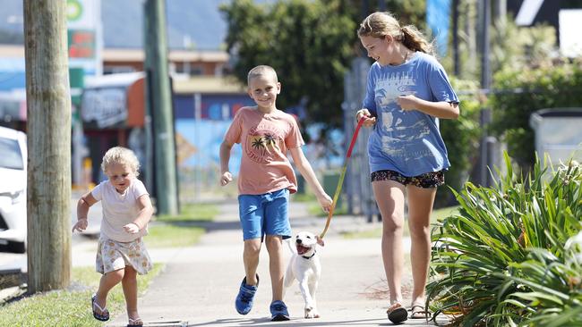 The weather in Cairns is forecast to remain sunny and warm throughout the week. Siblings Alissa Ryan, 2, Jordan, 7, and Sara, 12, take their bull arab cross puppy Marley out for a run in the fine weekend weather at Edmonton. Picture: Brendan Radke