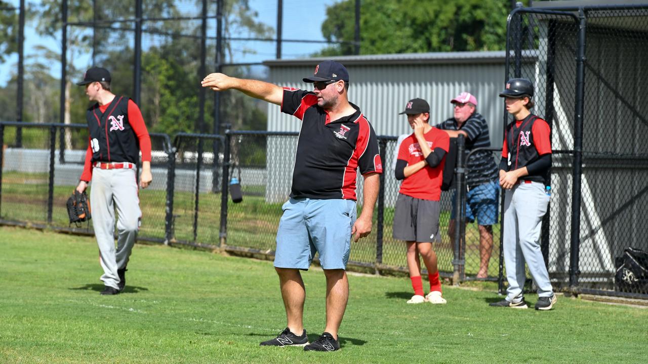 North's Baseball Club Coach Paul Simes giving instructions on the field in the friendly opener of the club's 75th season. Picture: Cath Piltz