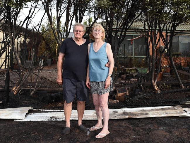 Grassfire behind Rowell Place in Taylors Lakes. (L-R) Ted and Val Skinner were home during the fire. The flames reached the back of their house. Picture: Josie Hayden