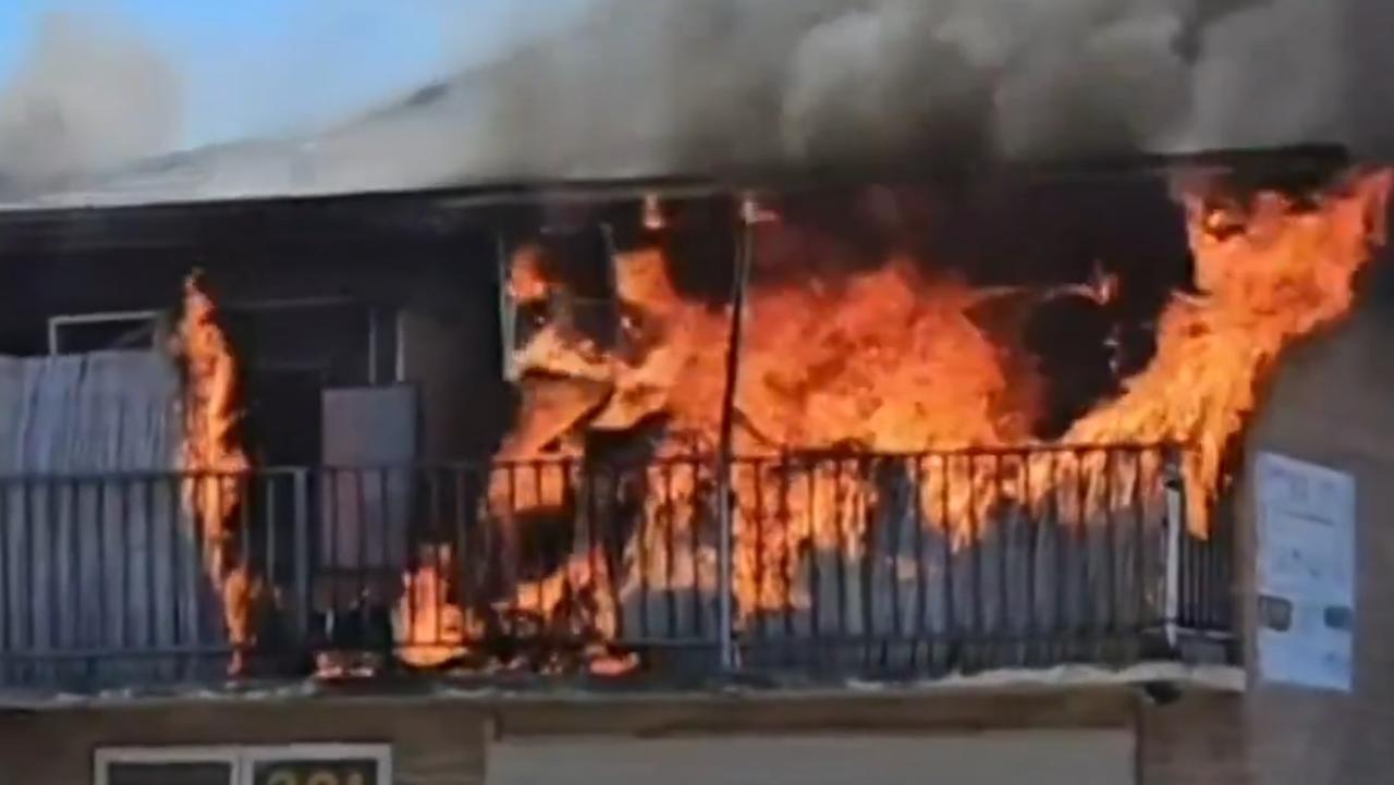 The top storey of a house engulfed in flames in an alleged arson attack.