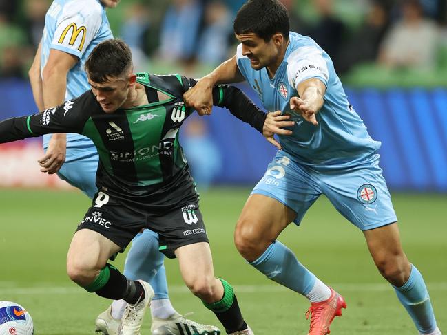 MELBOURNE, AUSTRALIA - DECEMBER 04: Dylan Wenzel-Halls of Western United is challenged by Nuno Reis of Melbourne City  during the A-League Mens match between Melbourne City and Western United at AAMI Park, on December 04, 2021, in Melbourne, Australia. (Photo by Robert Cianflone/Getty Images)