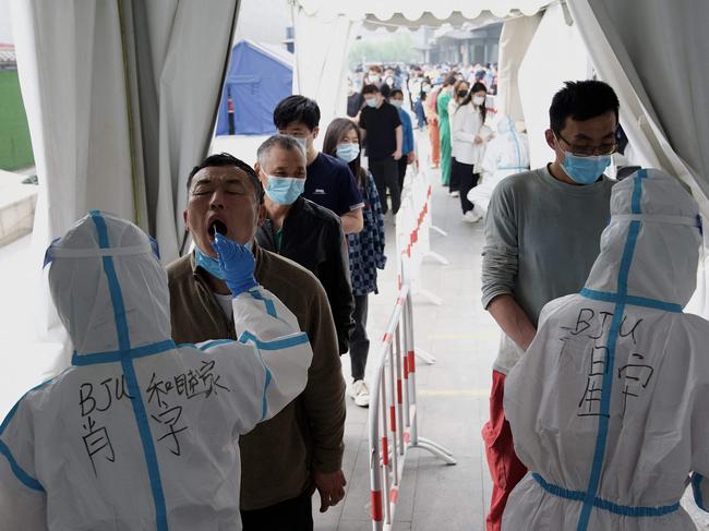 Cases surge in Beijing, Shanghai deaths triple