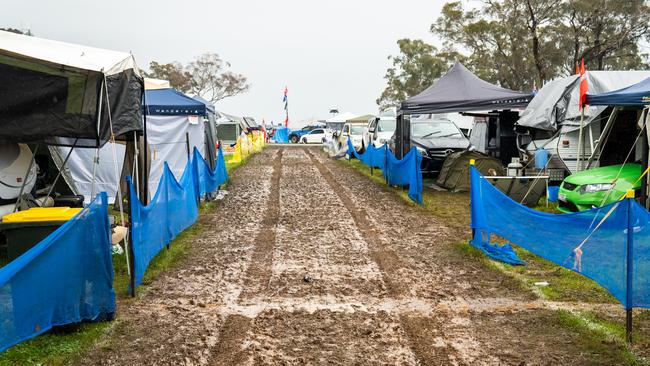 Semi-submerged campsites at the Bathurst 1000 were layered in thick sludge. Picture: Daniel Kalisz/Getty Images