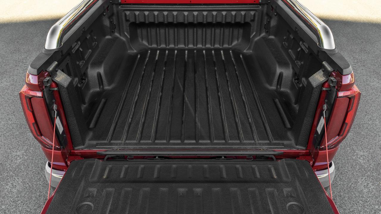 The bed liner is standard and there are three tie-down points on each side of the tray along with a 12-volt plug.