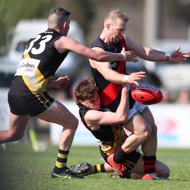 Boisdale-Briagolong’s Mathew Simmonds is tackled by Wy Yung’s Jet Kellow.