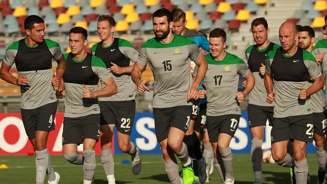 Mile Jedinak leads the team run at Socceroos training.