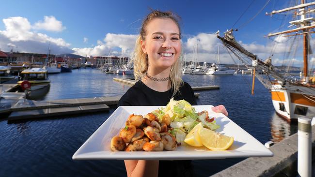 Waitress Ruby Keady with Fish Frenzy's pan-seared fresh Tasmanian scallops with salad.