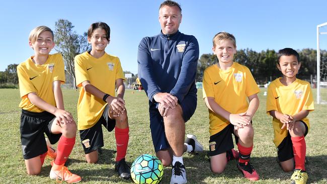 Sunshine Coast Fire /Sunshine Coast Sports Club are eight weeks into their new full-time football academy for kids. Its garnered the attention of Netflix who are filming a doco series on them. Pictured, Jett Ford, Cooper Renzulli, Melvyn Wilkes (centre), Daniel Dawes and Bodi Ahfock. Picture: Patrick Woods