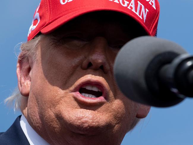 US President Donald Trump speaks at a "Make America Great Again" rally at Raymond James Stadium's parking lot on October 29, 2020, in Tampa, Florida. (Photo by Brendan Smialowski / AFP)