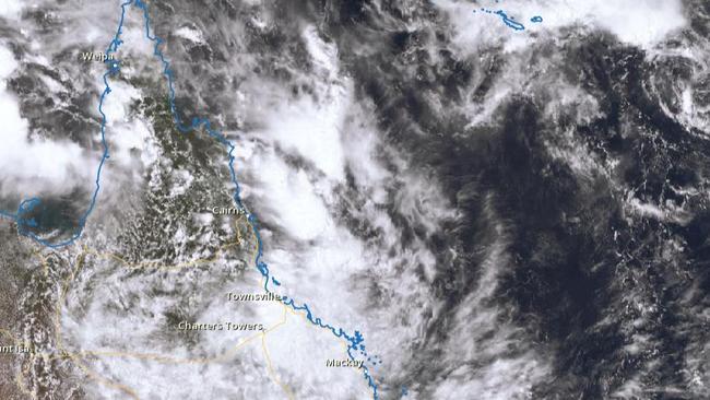 A satellite image of the tropical low sitting over North Queensland at midday on Sunday.