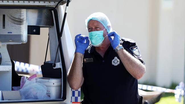 Police at the scene. Picture: NIGEL HALLETT