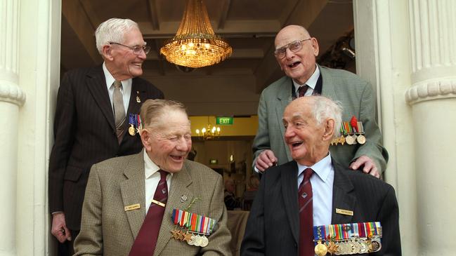 Clockwise from back left, Ed Ebsary with fellow former 2/27th Battalion members Bert Ward, Ray Baldwin and Eric Sambell catch up in 2012 after the Anzac Day march. Picture: Matt Turner