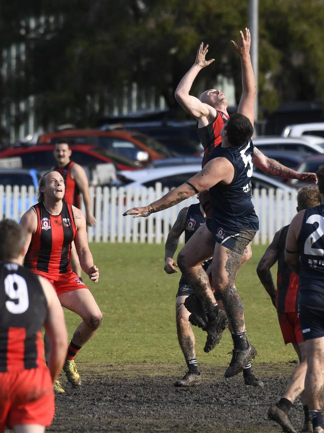 Timothy Lewis for Coolaroo and Callum Walters for Bombers. 2022 AFLDD Allied Cup - senior men, South Toowoomba Bombers vs Coolaroo. Saturday, September 3, 2022. Picture: Nev Madsen.