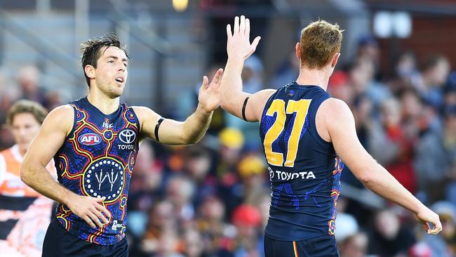 ADELAIDE, AUSTRALIA - JUNE 03: Richard Douglas of the Adelaide Crows celebrates a goal with Tom Lynch of the Adelaide Crows  during the round 11 AFL match between the Adelaide Crows and the Greater Western Sydney Giants at Adelaide Oval on June 3, 2018 in Adelaide, Australia.  (Photo by Mark Brake/Getty Images)