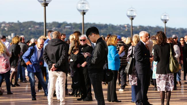 Crowds gather at the Sydney Opera House yesterday to farewell the Qantas 747. Photo: NCA Newswire/ Gaye Gerard