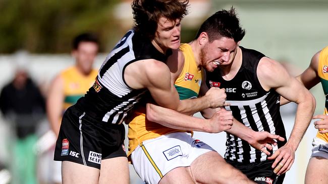 Jared Polec pressures Nick O'Brien. Picture: Calum Robertson.