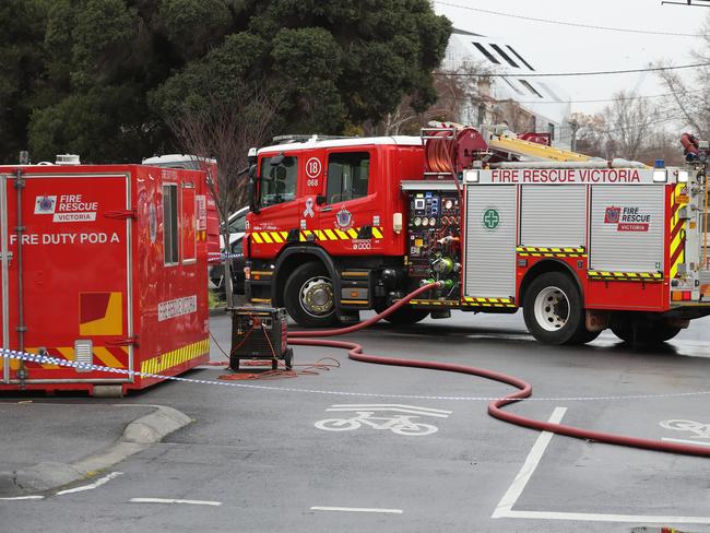 MELBOURNE, AUSTRALIA - NewsWire Photos, AUGUST 17, 2021. Police and fire fighters at the scene where following the arrest of a man following a fire at a service station in Fitzroy overnight: NCA NewsWire / David Crosling