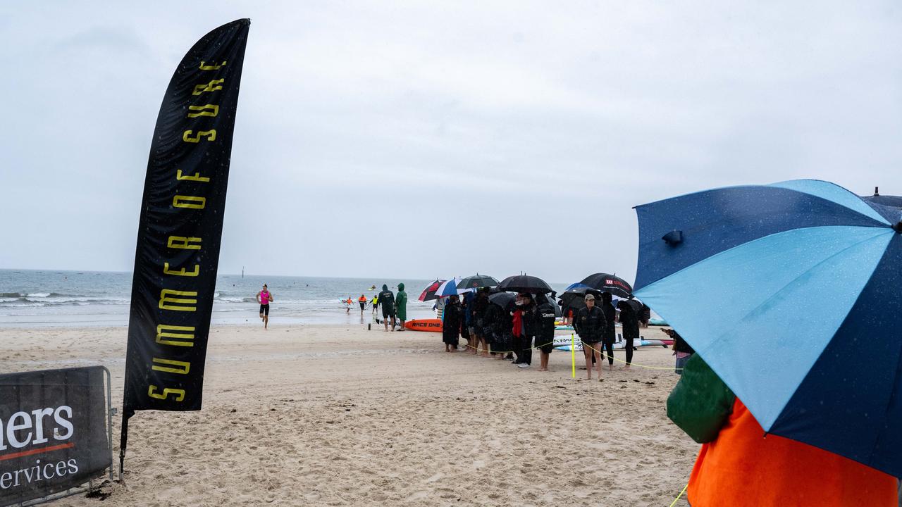 Wet weather at a competitive Surf Life Saving event at Glenelg Beach on Saturday. Picture: Morgan Sette