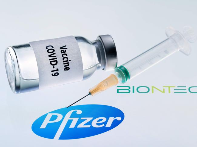 (FILES) In this illustration file photo taken on November 23, 2020 showing a bottle reading "Vaccine COVID-19" and a syringe next to the Pfizer and BioNtech logos. - An expert committee convened by the US Food and Drug Administration on December 10, 2020, voted heavily in favor of recommending the Pfizer-BioNTech Covid-19 vaccine for emergency use approval. (Photo by JOEL SAGET / AFP)