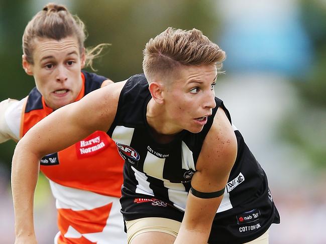 MELBOURNE, AUSTRALIA - FEBRUARY 18:  Emma Grant of the Magpies handballs during the round three AFLW match between the Collingwood Magpies and the Greater Western Sydney Giants at Olympic Park on February 18, 2018 in Melbourne, Australia.  (Photo by Michael Dodge/Getty Images)