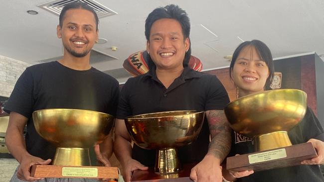 The Chow crew – Avi, Will and Lan – holding up their trio of Golden Bowls after adding the 2024 crown to their mantelpiece, tying for first with Bamboo Lounge. Picture: Supplied