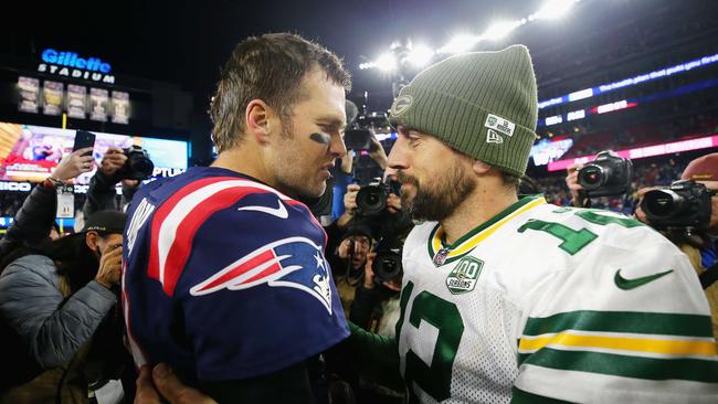 FOXBOROUGH, MA - NOVEMBER 04: Tom Brady #12 of the New England Patriots talks with Aaron Rodgers #12 of the Green Bay Packers after the Patriots defeated the Packers 31-17 at Gillette Stadium on November 4, 2018 in Foxborough, Massachusetts.   Maddie Meyer/Getty Images/AFP == FOR NEWSPAPERS, INTERNET, TELCOS & TELEVISION USE ONLY ==