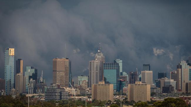 Ominous clouds pass over Melbourne as a storm front thunders through. Picture: Jake Nowakowski