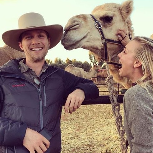 Wild … Cuoco with husband Karl Cook at the Uluru Camel Farm. Picture: Instagram