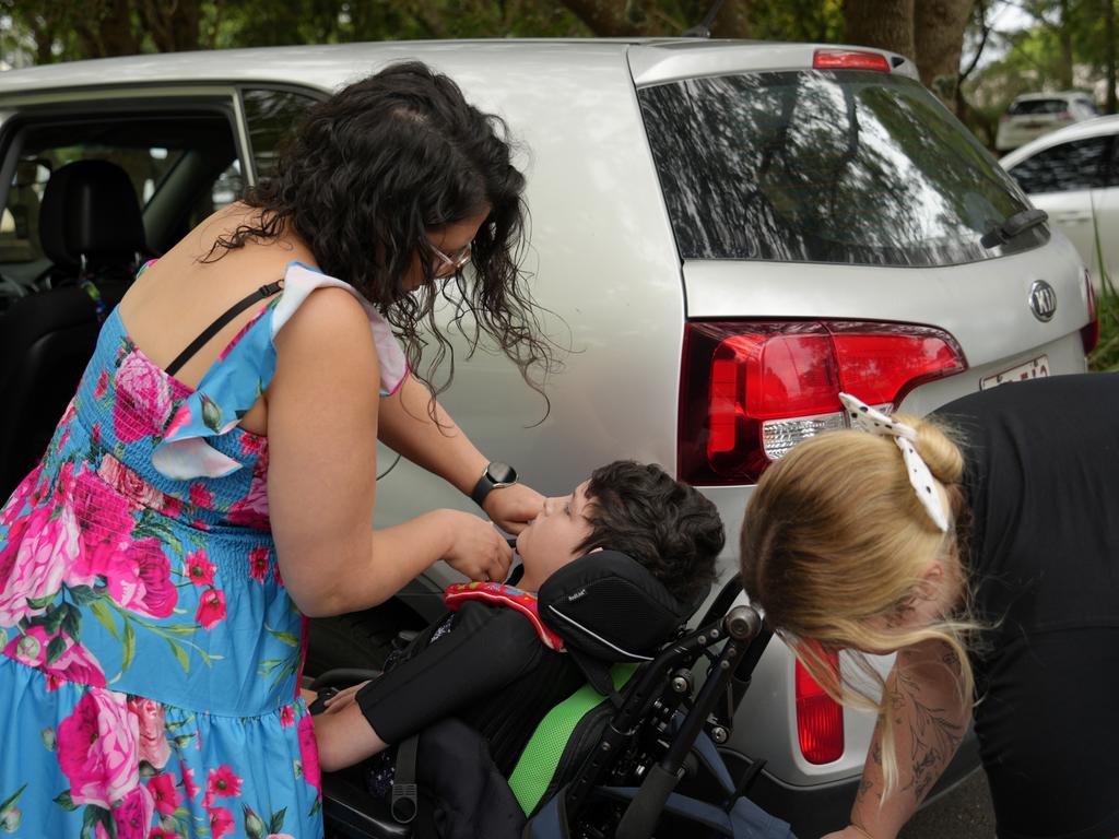 Taegan Stevens and Amy Gray dropping Oscar off at school.