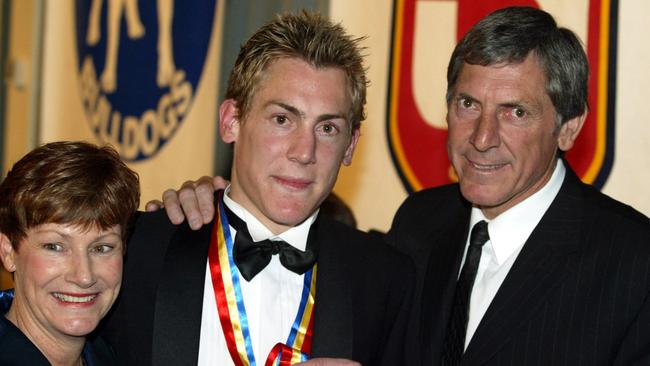 Brett Ebert (centre) with his mother Dianne and father Russell after winning the Magarey Medal in 2003. Picture: Cameron Richardson.