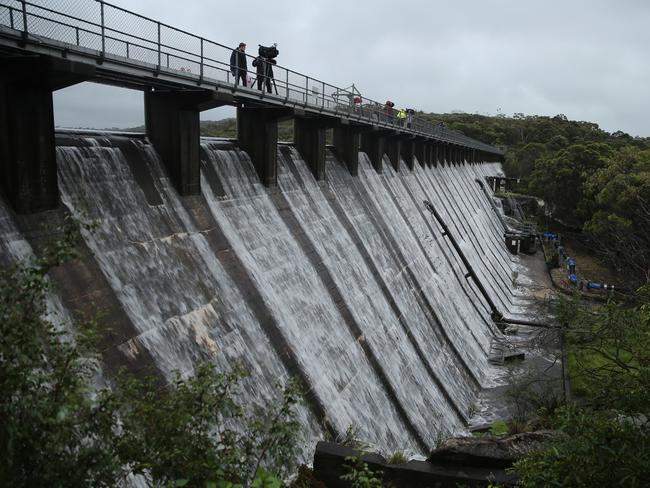 Manly dam above North Manly is overflowing putting more stress on the Manly lagoon catchment area. Pic John Grainger