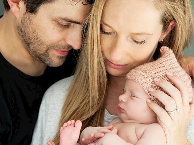 Rachael and Jonathan Casella with Mackenzie, who inherited the SMA gene from both her parents.