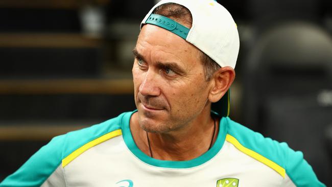 BRISBANE, AUSTRALIA - DECEMBER 08: Australian coach Justin Langer looks on during a rain delay during day one of the First Test Match in the Ashes series between Australia and England at The Gabba on December 08, 2021 in Brisbane, Australia. (Photo by Chris Hyde/Getty Images)